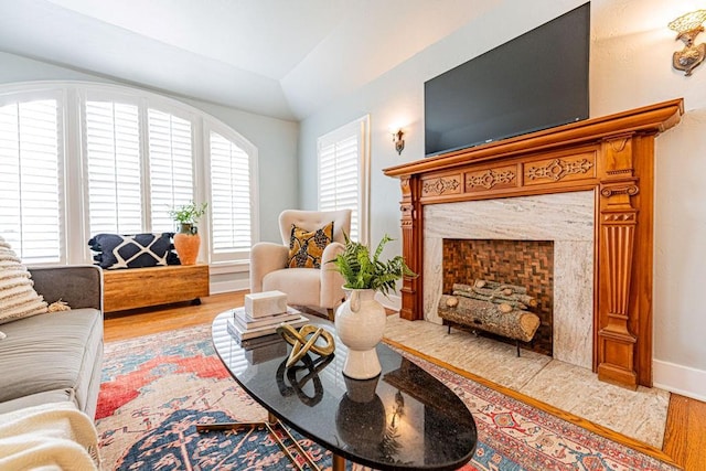416 W Hill St, Oklahoma City, OK 73118 - living room with wood finished floors, lofted ceiling, and a premium fireplace
