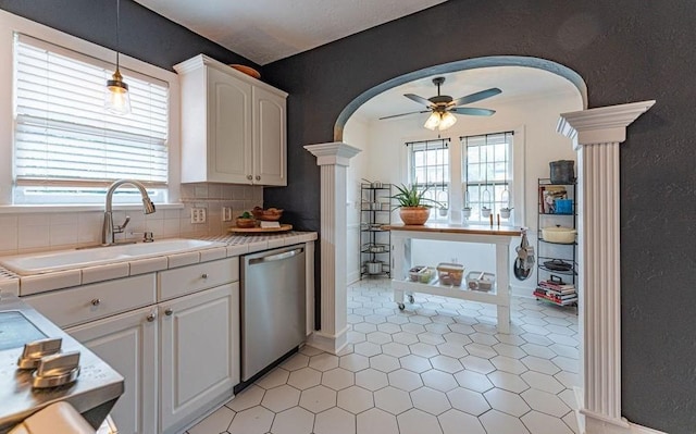 416 W Hill St, Oklahoma City, OK 73118 - kitchen with dishwasher, arched walkways, tile countertops, ornate columns, and ceiling fan