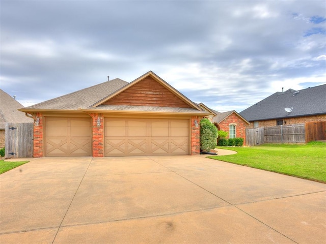 2801 SE 5th St, Moore, OK 73160 - view of front of house with brick siding, driveway, an attached garage, and roof with shingles