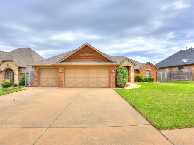 2801 SE 5th St, Moore, OK 73160 - view of front facade featuring a garage, driveway, and brick siding