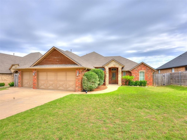 2801 SE 5th St, Moore, OK 73160 - view of front facade featuring a garage, driveway, brick siding, and roof with shingles