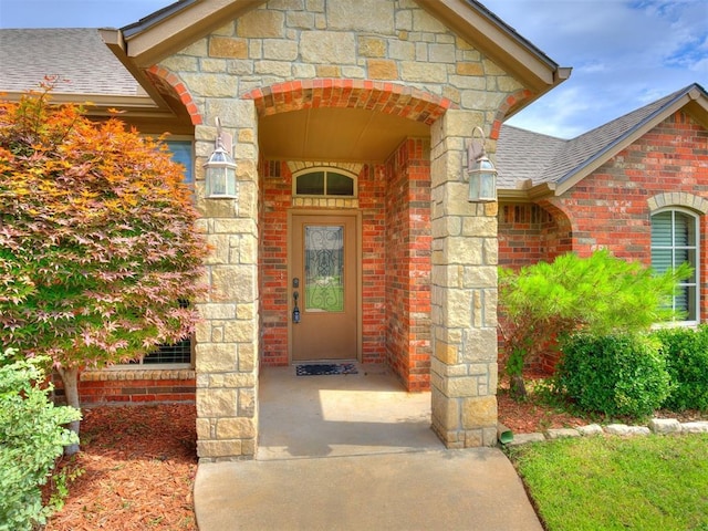 2801 SE 5th St, Moore, OK 73160 - entrance to property with roof with shingles, stone siding, and brick siding