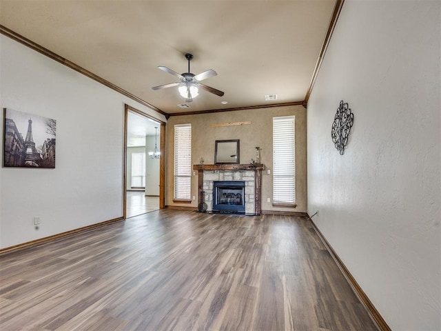 2801 SE 5th St, Moore, OK 73160 - unfurnished living room with wood finished floors, a ceiling fan, ornamental molding, and a fireplace