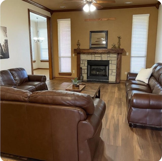 2801 SE 5th St, Moore, OK 73160 - living room featuring ornamental molding, ceiling fan, wood finished floors, and a fireplace