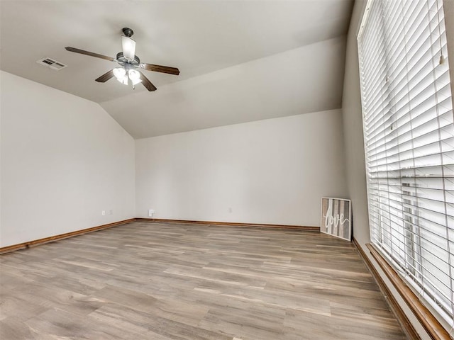 2801 SE 5th St, Moore, OK 73160 - unfurnished room with ceiling fan, vaulted ceiling, plenty of natural light, and wood finished floors