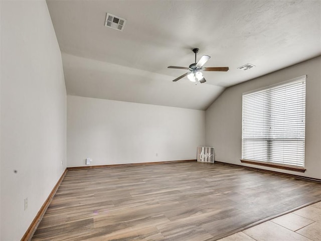 2801 SE 5th St, Moore, OK 73160 - additional living space with lofted ceiling, a ceiling fan, and light wood-type flooring