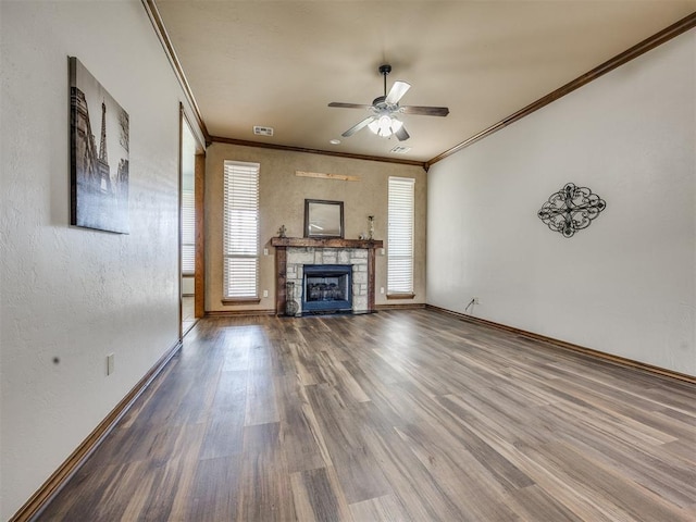 2801 SE 5th St, Moore, OK 73160 - unfurnished living room with a stone fireplace, a ceiling fan, wood finished floors, and ornamental molding