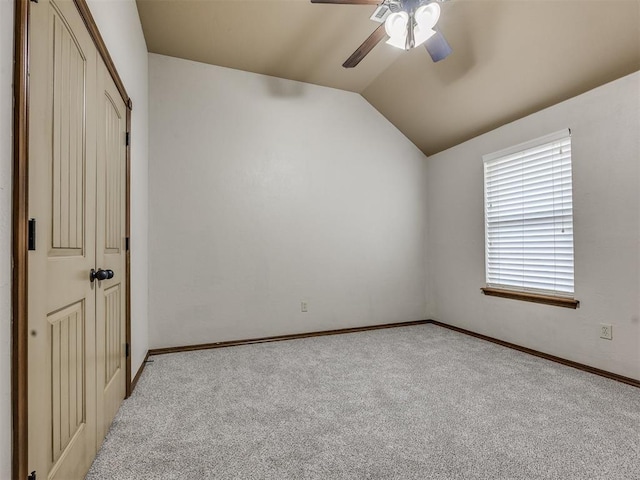 2801 SE 5th St, Moore, OK 73160 - unfurnished bedroom with light colored carpet, lofted ceiling, ceiling fan, and a closet