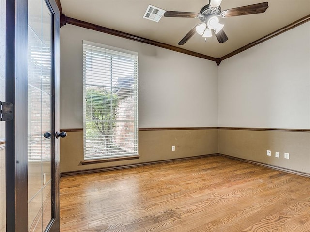2801 SE 5th St, Moore, OK 73160 - unfurnished room with ornamental molding, wood finished floors, and a ceiling fan