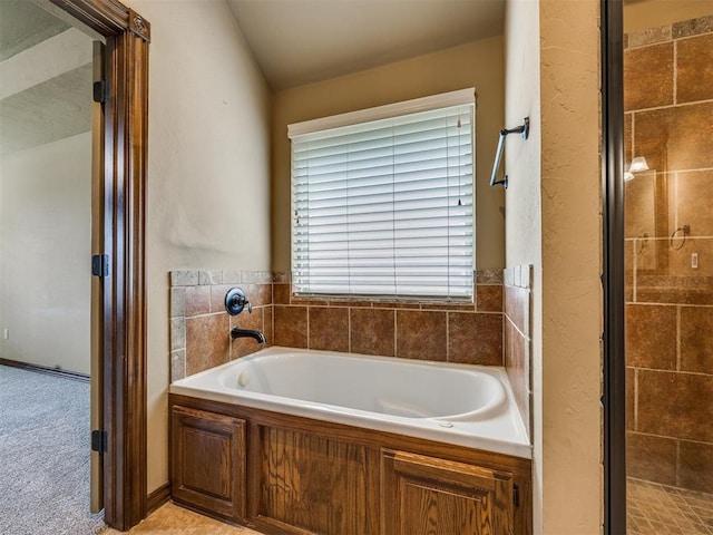 2801 SE 5th St, Moore, OK 73160 - bathroom featuring a garden tub and a shower stall