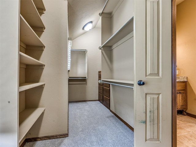 2801 SE 5th St, Moore, OK 73160 - walk in closet featuring vaulted ceiling and light carpet