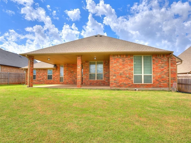 2801 SE 5th St, Moore, OK 73160 - back of house with brick siding and a patio area