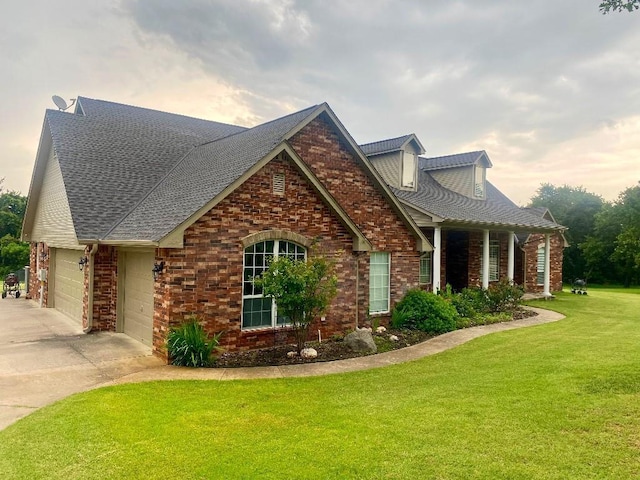 450 Hickory Hill Dr, Choctaw, OK 73020 - view of front facade with an attached garage, driveway, a front lawn, and brick siding