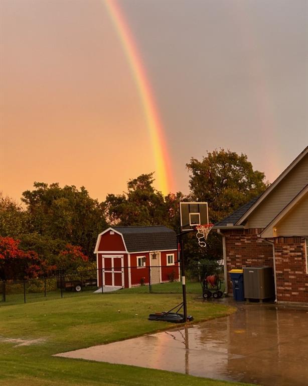 450 Hickory Hill Dr, Choctaw, OK 73020 - view of basketball court featuring a storage unit