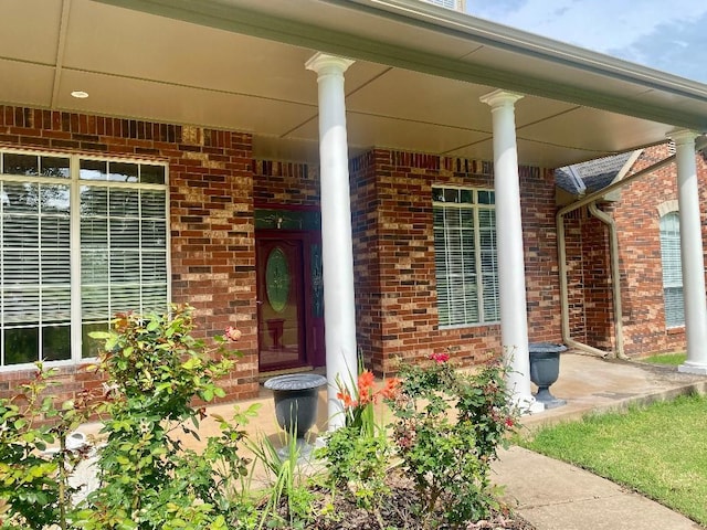 450 Hickory Hill Dr, Choctaw, OK 73020 - entrance to property with brick siding and a porch