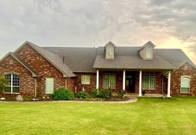 450 Hickory Hill Dr, Choctaw, OK 73020 - cape cod home featuring a front lawn, brick siding, and a shingled roof