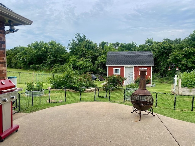 450 Hickory Hill Dr, Choctaw, OK 73020 - view of patio with a storage unit and area for grilling