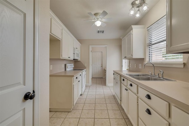 12210 High Meadow Ct, Oklahoma City, OK 73170 - kitchen featuring white appliances, light countertops, a ceiling fan, light tile patterned floors, and white cabinets