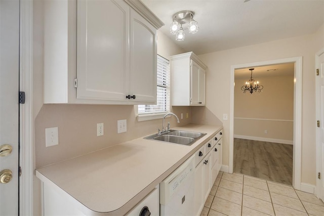 12210 High Meadow Ct, Oklahoma City, OK 73170 - kitchen featuring white dishwasher, a chandelier, white cabinets, and light countertops