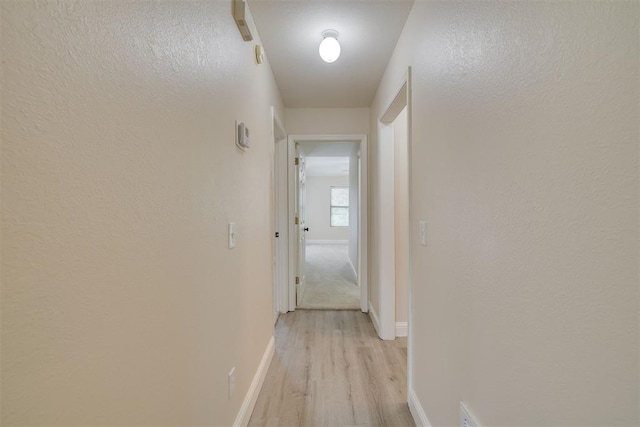 12210 High Meadow Ct, Oklahoma City, OK 73170 - corridor with light wood-style floors and baseboards