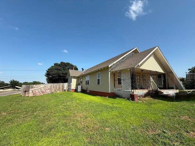 223 N Market St, Cordell, OK 73632 - view of side of home with a central air condition unit