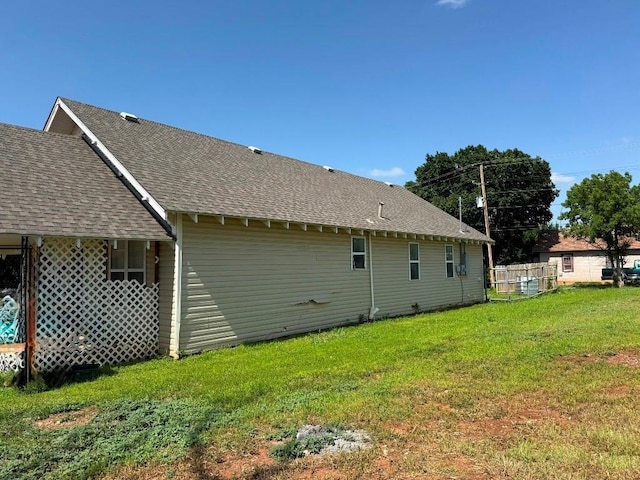 223 N Market St, Cordell, OK 73632 - back of property featuring a shingled roof