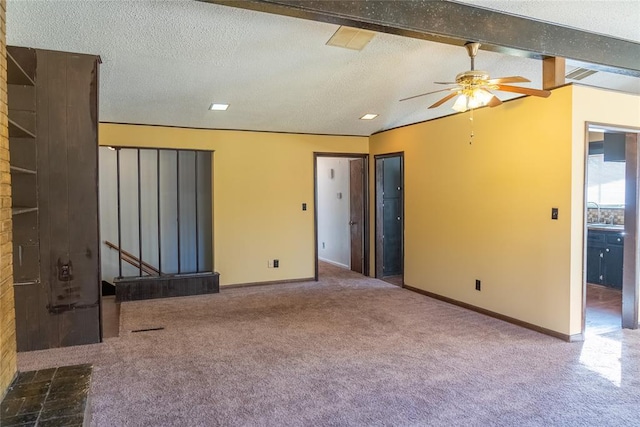 2728 NE 99th St, Oklahoma City, OK 73131 - empty room featuring carpet flooring, a ceiling fan, and a textured ceiling