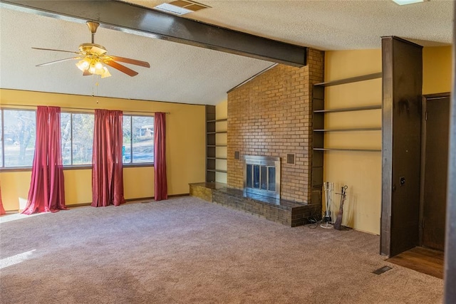 2728 NE 99th St, Oklahoma City, OK 73131 - unfurnished living room with a textured ceiling, carpet flooring, a ceiling fan, and a brick fireplace