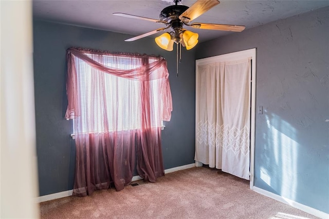 2728 NE 99th St, Oklahoma City, OK 73131 - carpeted spare room featuring a ceiling fan and baseboards