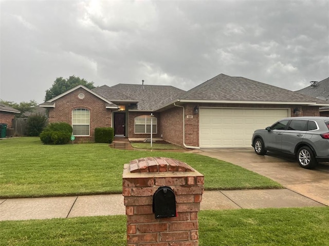 509 SW 159th St, Oklahoma City, OK 73170 - single story home with a shingled roof, concrete driveway, an attached garage, brick siding, and a front yard