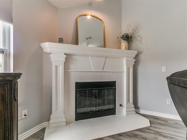 1401 Baycharter St, Norman, OK 73071 - detailed view of wood finished floors and a fireplace