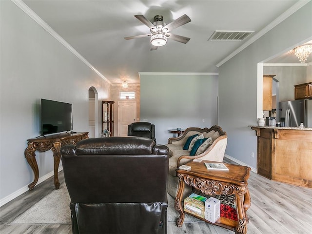 1401 Baycharter St, Norman, OK 73071 - living room with arched walkways, ceiling fan, light wood finished floors, and ornamental molding