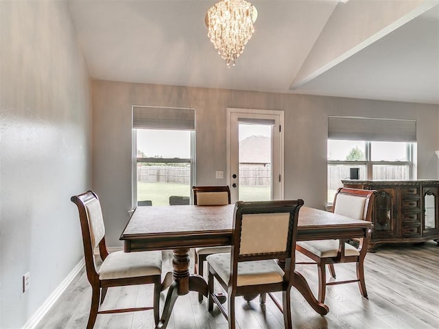 1401 Baycharter St, Norman, OK 73071 - dining space featuring vaulted ceiling, a chandelier, and light wood-style floors