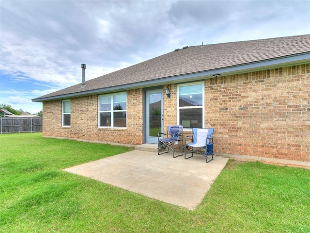 1401 Baycharter St, Norman, OK 73071 - rear view of house featuring brick siding, roof with shingles, and a patio