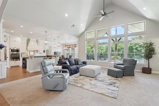 19804 Dalemead Way, Edmond, OK 73012 - living area with recessed lighting, high vaulted ceiling, ceiling fan, and a chandelier