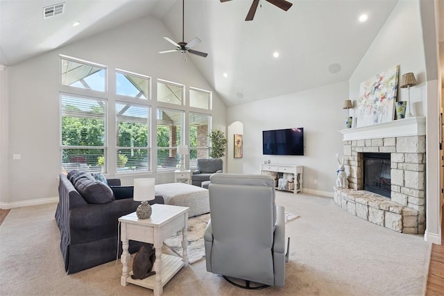 19804 Dalemead Way, Edmond, OK 73012 - living room featuring high vaulted ceiling, ceiling fan, a fireplace, recessed lighting, and arched walkways