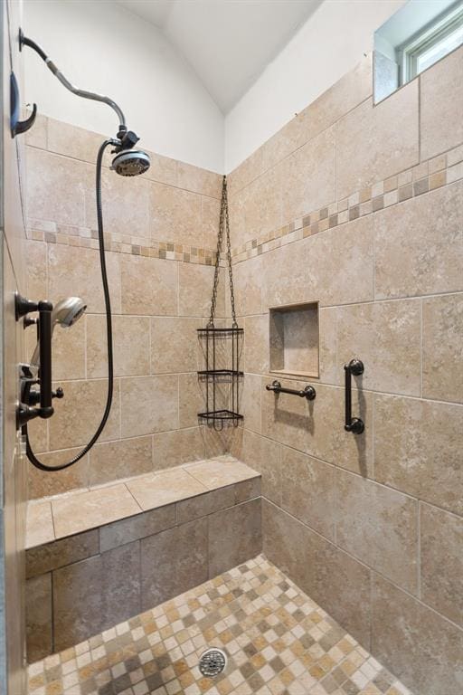 19804 Dalemead Way, Edmond, OK 73012 - bathroom featuring a tile shower and vaulted ceiling