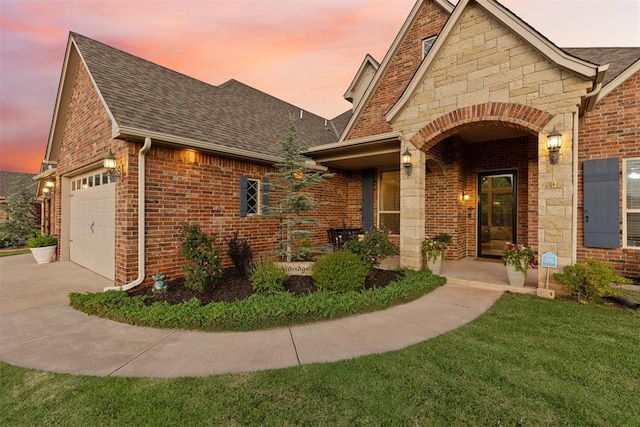 19804 Dalemead Way, Edmond, OK 73012 - view of front of house featuring roof with shingles, a garage, brick siding, and concrete driveway