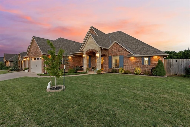 19804 Dalemead Way, Edmond, OK 73012 - view of front of house featuring brick siding, roof with shingles, a garage, and concrete driveway