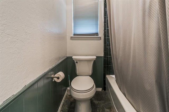 100 Three Oaks Dr, Midwest City, OK 73130 - full bathroom with shower / tub combo, a textured wall, and a wainscoted wall
