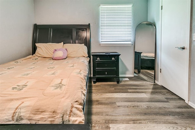 100 Three Oaks Dr, Midwest City, OK 73130 - bedroom with wood finished floors