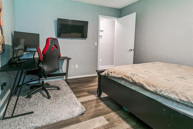 100 Three Oaks Dr, Midwest City, OK 73130 - bedroom featuring dark wood-style floors and a desk