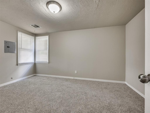 6617 NW 31st St, Bethany, OK 73008 - carpeted empty room featuring electric panel and a textured ceiling