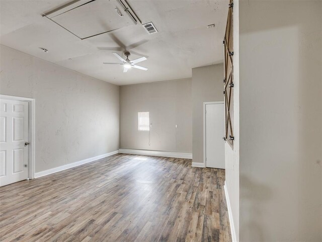 6617 NW 31st St, Bethany, OK 73008 - unfurnished room with attic access, wood finished floors, and a ceiling fan