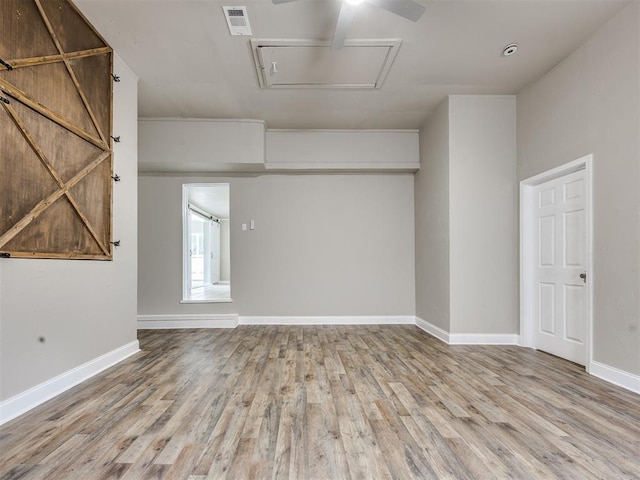 6617 NW 31st St, Bethany, OK 73008 - spare room featuring attic access and wood finished floors
