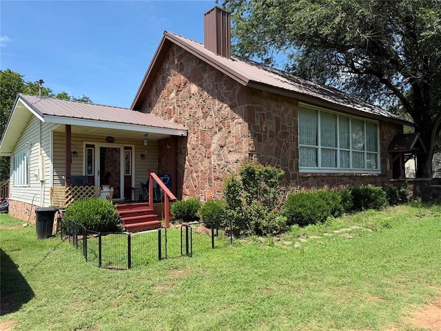 342532 E 1020th Rd, Meeker, OK 74855 - view of front of property featuring a porch, a front lawn, stone siding, and a metal roof