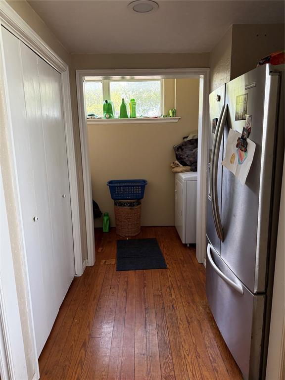 342532 E 1020th Rd, Meeker, OK 74855 - laundry area featuring wood-type flooring and independent washer and dryer