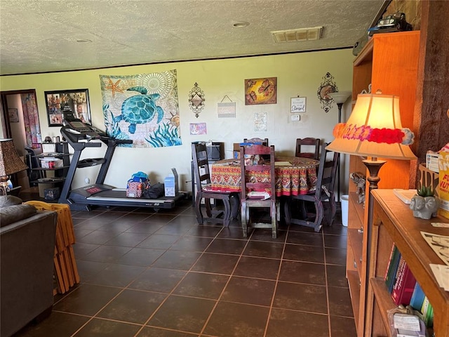 342532 E 1020th Rd, Meeker, OK 74855 - dining area with a textured ceiling and dark tile patterned floors