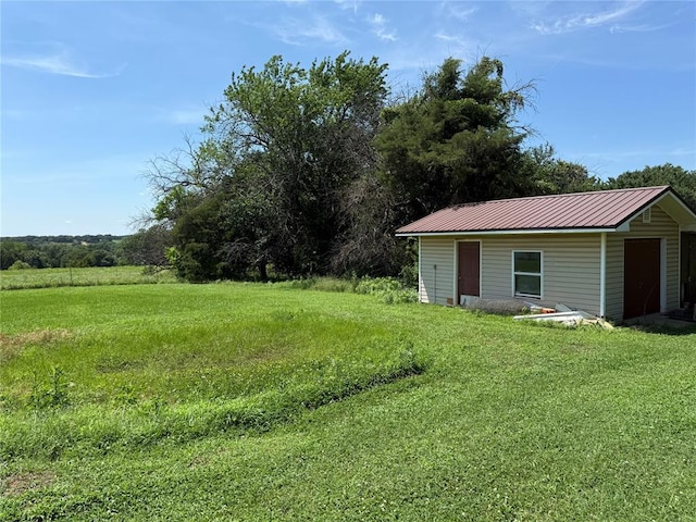 342532 E 1020th Rd, Meeker, OK 74855 - view of green lawn with an outbuilding