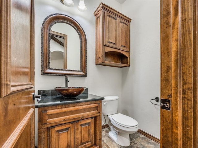 4109 Slate Bridge Rd, Edmond, OK 73034 - bathroom featuring baseboards and vanity